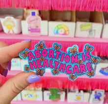 Load image into Gallery viewer, Abortion Is Healthcare Glitter Sticker